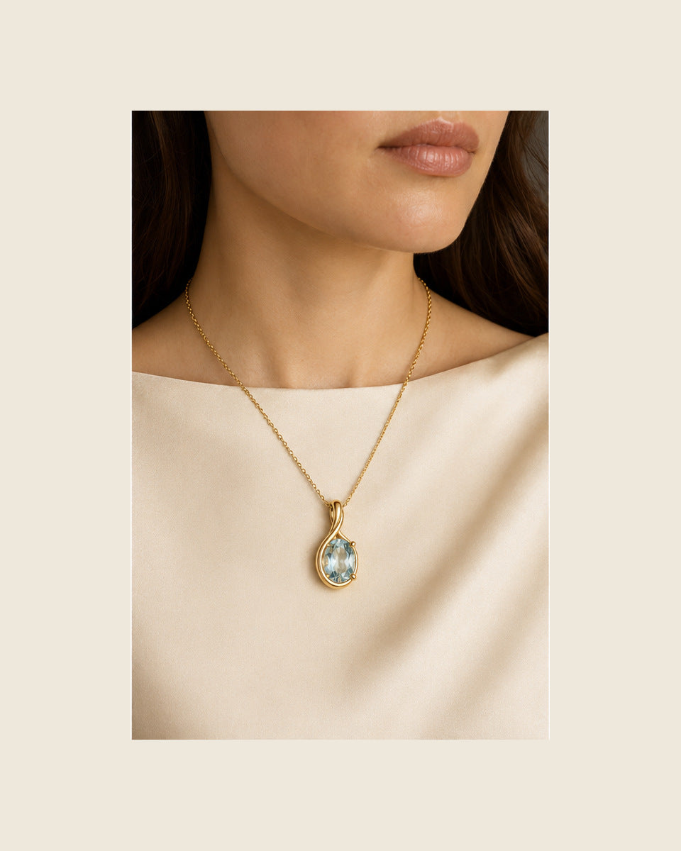 Aurea Forma Medallion — Aquamarine — shown worn by a woman for scale