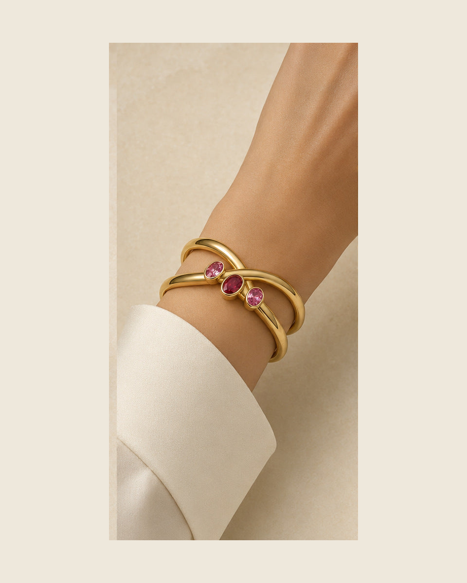 Aurea Forma Embrace Cuff — Ruby & Pink Spinel — shown worn by a woman for scale