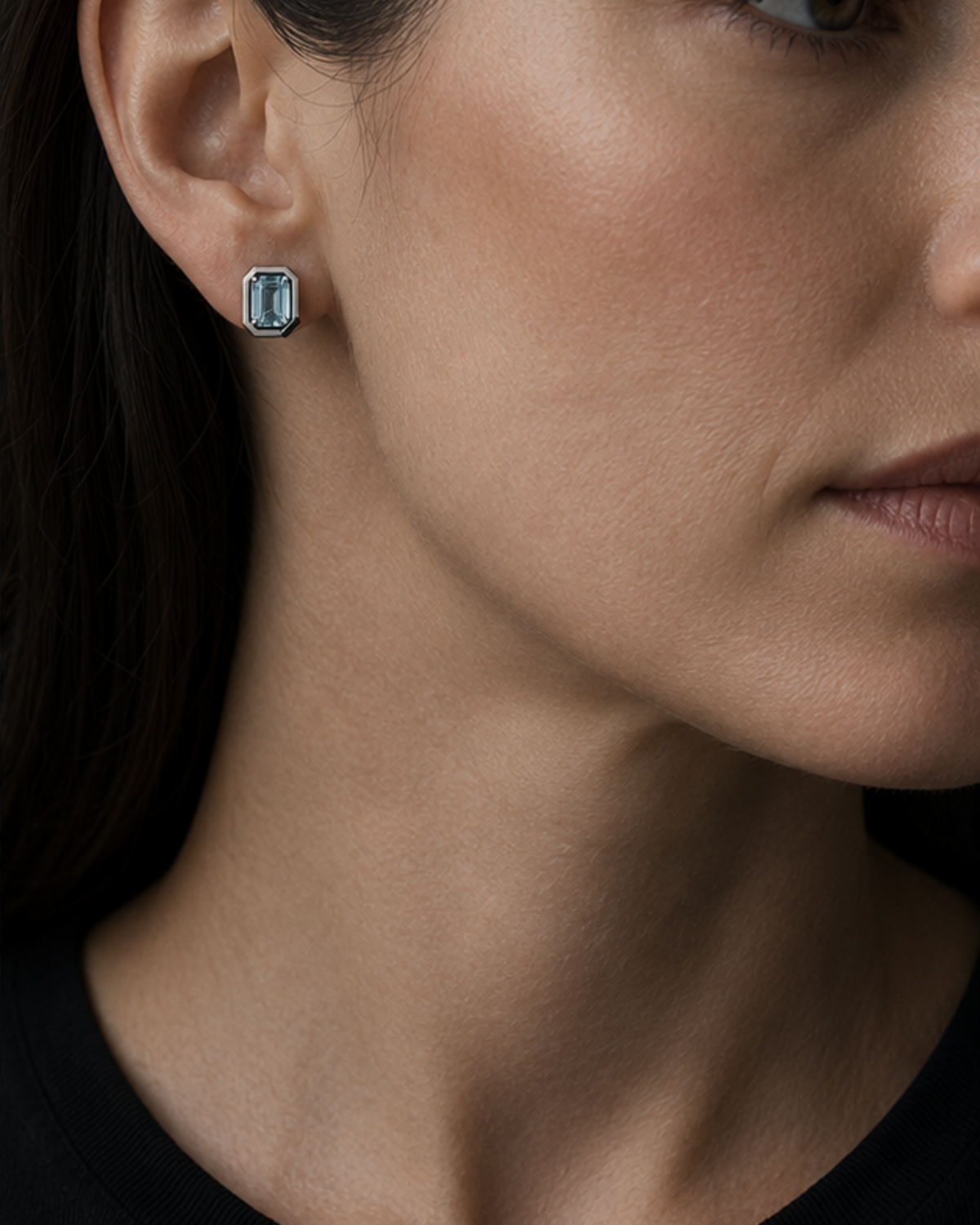 Adult woman wearing Cipher Studs 16 at approximate scale