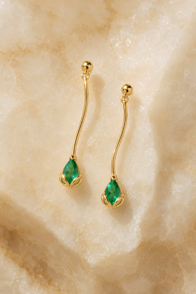 Veil Emerald Drop Earrings — 14k Gold product visualization on warm alabaster