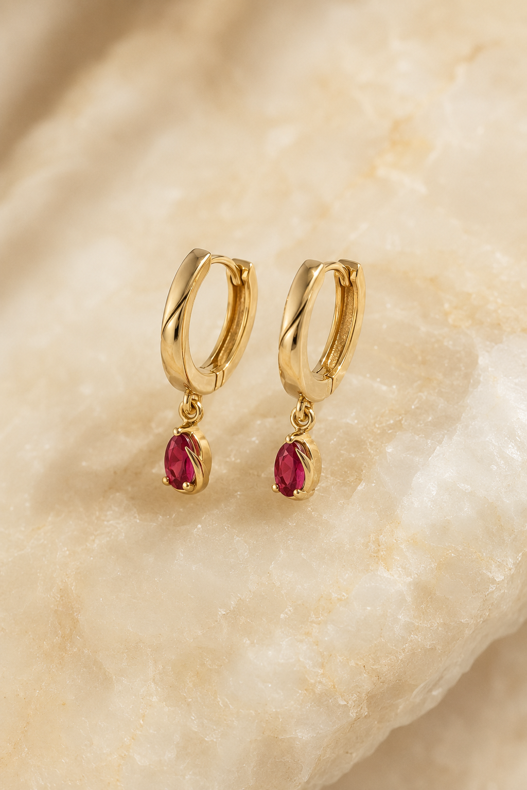 Veil Ruby Huggies — 14k Gold product visualization on warm alabaster