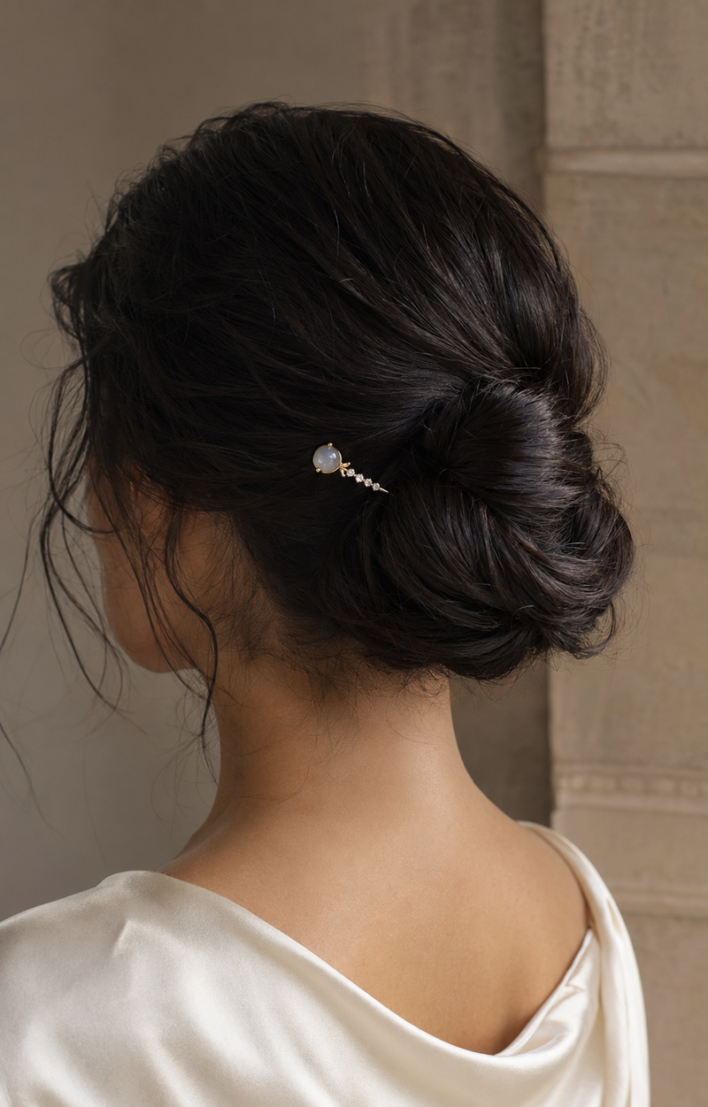 Forgemier Cometline Hairpin in 14k yellow gold with moonstone and lab-grown diamonds, shown worn to scale