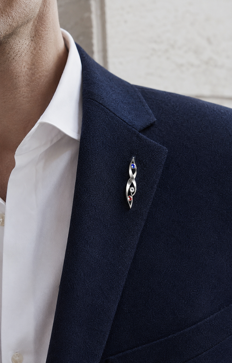 Forgemier Liberty Flame Lapel Pin in sterling silver with red white and blue gemstones, shown worn to scale