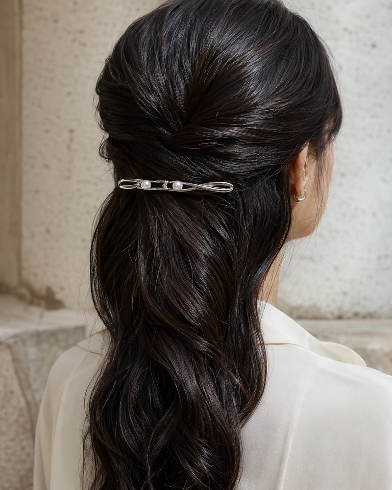 Forgemier Pearl Orbit Barrette in sterling silver with two captive pearls and lab-grown diamonds, shown worn to scale