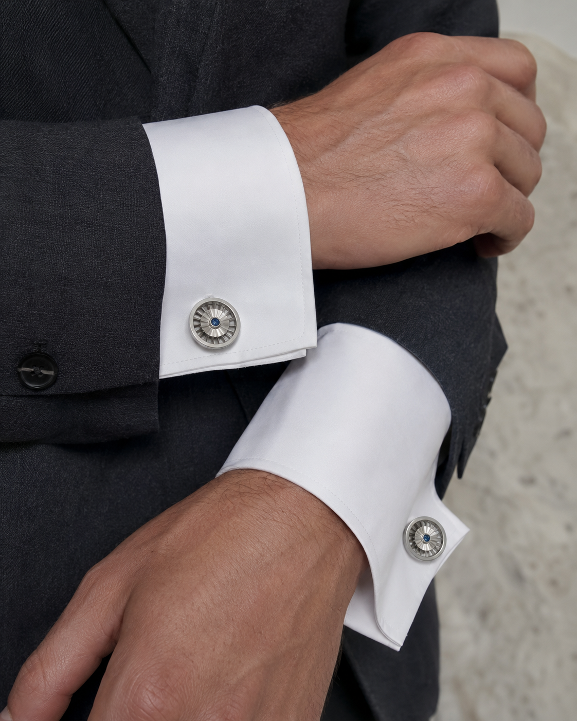 Forgemier Turbine Spin Cufflinks in sterling silver with blue sapphire, shown worn to scale