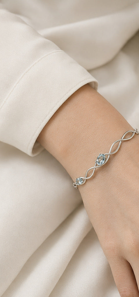 Lilt Current Bracelet — Aquamarine — shown worn by a woman for scale