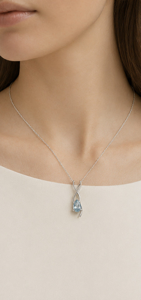 Lilt Dew Pendant — Aquamarine — shown worn by a woman for scale
