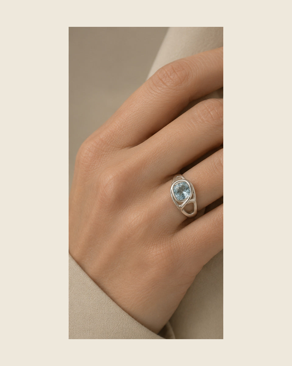 Lilt Forma Signet — Aquamarine — shown worn by a woman for scale