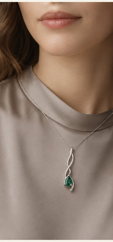 Lilt Tendril Necklace — Emerald — shown worn by a woman for scale